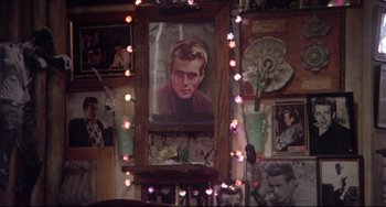 Movie still from “Come Back to the 5 & Dime Jimmy Dean, Jimmy Dean” (1982), directed by Robert Altman – A portrait of a man hanging on the wall; Close Up shot, Low angle