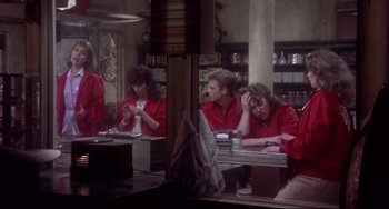 Movie still from “Come Back to the 5 & Dime Jimmy Dean, Jimmy Dean” (1982), directed by Robert Altman – A group of people sitting at a table in front of a mirror; Wide shot, Over the shoulder angle