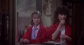 Movie still from “Come Back to the 5 & Dime Jimmy Dean, Jimmy Dean” (1982), directed by Robert Altman – Two women sitting at a table in front of pizza; Medium shot, Over the shoulder angle