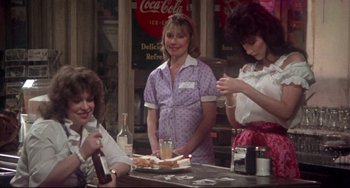 Movie still from “Come Back to the 5 & Dime Jimmy Dean, Jimmy Dean” (1982), directed by Robert Altman – A group of women sitting at a table with food; Medium shot, Over the shoulder angle
