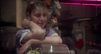 Movie still from “Come Back to the 5 & Dime Jimmy Dean, Jimmy Dean” (1982), directed by Robert Altman – A young girl sitting at a table in a restaurant; Close Up shot, Over the shoulder angle