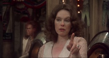 Movie still from “Come Back to the 5 & Dime Jimmy Dean, Jimmy Dean” (1982), directed by Robert Altman – A woman is pointing her finger at the camera; Close Up shot, Over the shoulder angle