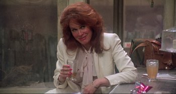 Movie still from “Come Back to the 5 & Dime Jimmy Dean, Jimmy Dean” (1982), directed by Robert Altman – A woman sitting at a table holding a glass; Close Up shot, Over the shoulder angle