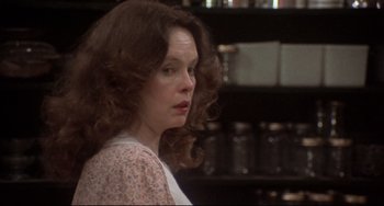 Movie still from “Come Back to the 5 & Dime Jimmy Dean, Jimmy Dean” (1982), directed by Robert Altman – A person with long curly hair; Close Up shot, Over the shoulder angle