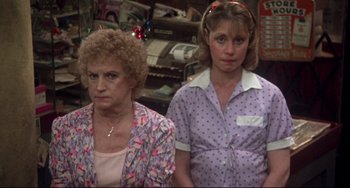 Movie still from “Come Back to the 5 & Dime Jimmy Dean, Jimmy Dean” (1982), directed by Robert Altman – Two women standing next to each other in a store; Medium shot, High angle