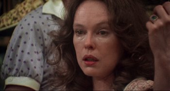 Movie still from “Come Back to the 5 & Dime Jimmy Dean, Jimmy Dean” (1982), directed by Robert Altman – A person with long hair; Close Up shot, Over the shoulder angle