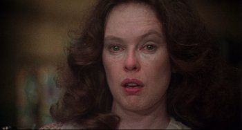 Movie still from “Come Back to the 5 & Dime Jimmy Dean, Jimmy Dean” (1982), directed by Robert Altman – A woman's face as she stares at the camera; Close Up shot, Low angle