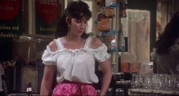 Movie still from “Come Back to the 5 & Dime Jimmy Dean, Jimmy Dean” (1982), directed by Robert Altman – A woman standing in front of a counter in a kitchen; Medium shot, Over the shoulder angle