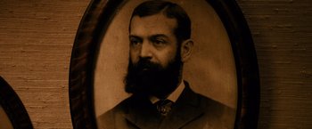 Movie still from “The Descendants” (2011), directed by Alexander Payne – An old photograph of a man with a beard; Extreme Close Up shot, Low angle