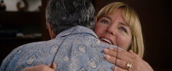Movie still from “The Descendants” (2011), directed by Alexander Payne – A woman is hugging a man with blue eyes; Close Up shot, Over the shoulder angle