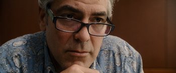 Movie still from “The Descendants” (2011), directed by Alexander Payne – A person wearing glasses; Close Up shot, Over the shoulder angle