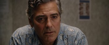 Movie still from “The Descendants” (2011), directed by Alexander Payne – A person wearing a blue shirt; Close Up shot, Over the shoulder angle