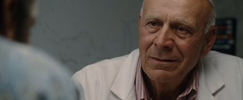 Movie still from “The Descendants” (2011), directed by Alexander Payne – An older man wearing a white lab coat; Close Up shot, Low angle