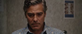 Movie still from “The Descendants” (2011), directed by Alexander Payne – A person wearing a blue shirt; Close Up shot, Over the shoulder angle