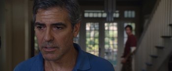 Movie still from “The Descendants” (2011), directed by Alexander Payne – A person wearing a blue shirt; Close Up shot, Over the shoulder angle