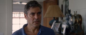 Movie still from “The Descendants” (2011), directed by Alexander Payne – A person in a room with a lamp; Close Up shot, Over the shoulder angle