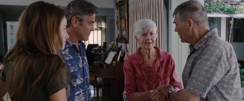 Movie still from “The Descendants” (2011), directed by Alexander Payne – An older woman and a younger man in a living room; Medium shot, Over the shoulder angle
