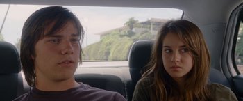 Movie still from “The Descendants” (2011), directed by Alexander Payne – A man and a woman sitting in the back of a car; Close Up shot, Over the shoulder angle