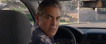 Movie still from “The Descendants” (2011), directed by Alexander Payne – A person sitting in a car; Close Up shot, Over the shoulder angle