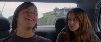 Movie still from “The Descendants” (2011), directed by Alexander Payne – A man and a woman sitting in the back of a car; Close Up shot, Over the shoulder angle