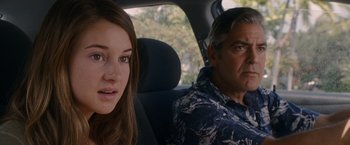 Movie still from “The Descendants” (2011), directed by Alexander Payne – A man and a woman sitting in the back of a car; Close Up shot, Over the shoulder angle