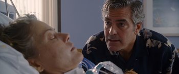 Movie still from “The Descendants” (2011), directed by Alexander Payne – A man and a woman looking at each other in a hospital room; Close Up shot, Over the shoulder angle
