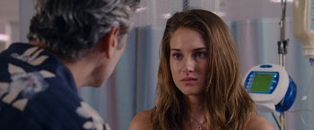 Movie still from “The Descendants” (2011), directed by Alexander Payne – A young woman looking at a man in the mirror; Close Up shot, Over the shoulder angle