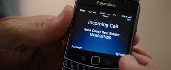 Movie still from “The Descendants” (2011), directed by Alexander Payne – A person holding a cell phone; Extreme Close Up shot, High angle