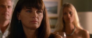 Movie still from “The Descendants” (2011), directed by Alexander Payne – A person with long brown hair; Close Up shot, Over the shoulder angle