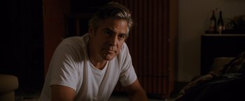 Movie still from “The Descendants” (2011), directed by Alexander Payne – A person wearing a white t - shirt; Close Up shot, Low angle