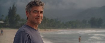 Movie still from “The Descendants” (2011), directed by Alexander Payne – A person standing near the ocean; Close Up shot, Over the shoulder angle