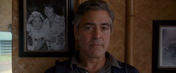 Movie still from “The Descendants” (2011), directed by Alexander Payne – A person wearing a jacket; Close Up shot, Over the shoulder angle