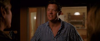 Movie still from “The Descendants” (2011), directed by Alexander Payne – A person wearing a plaid shirt; Close Up shot, Over the shoulder angle