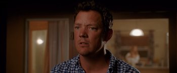 Movie still from “The Descendants” (2011), directed by Alexander Payne – A person wearing a plaid shirt; Close Up shot, Over the shoulder angle