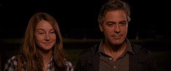 Movie still from “The Descendants” (2011), directed by Alexander Payne – A man and a woman standing next to each other in the dark; Close Up shot, Over the shoulder angle