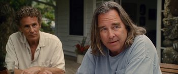 Movie still from “The Descendants” (2011), directed by Alexander Payne – A person with long grey hair; Close Up shot, Over the shoulder angle