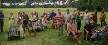 Movie still from “The Descendants” (2011), directed by Alexander Payne – A group of people sitting in a grassy field; Wide shot, High angle