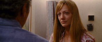 Movie still from “The Descendants” (2011), directed by Alexander Payne – A woman sitting in front of a mirror looking sad; Close Up shot, Over the shoulder angle