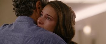 Movie still from “The Descendants” (2011), directed by Alexander Payne – A young woman hugging an older man with her eyes closed; Close Up shot, Over the shoulder angle
