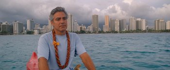 Movie still from “The Descendants” (2011), directed by Alexander Payne – A man sitting on a boat in the water; Close Up shot, Over the shoulder angle