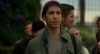 Movie still from “Comet” (2014), directed by Sam Esmail – A man in a red hat and a green jacket; Close Up shot, Over the shoulder angle