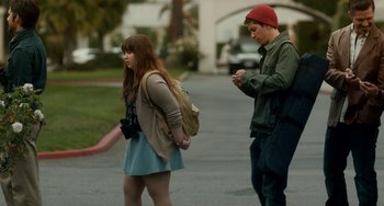 Movie still from “Comet” (2014), directed by Sam Esmail – A man and a woman standing on the side of a road; Medium shot, Over the shoulder angle