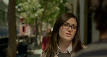 Movie still from “Comet” (2014), directed by Sam Esmail – A woman with glasses is looking at the camera; Close Up shot, Over the shoulder angle