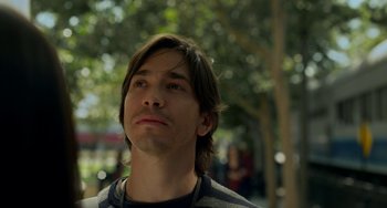 Movie still from “Comet” (2014), directed by Sam Esmail – A person with long brown hair; Close Up shot, Low angle