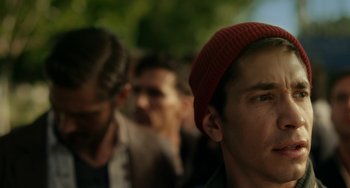 Movie still from “Comet” (2014), directed by Sam Esmail – A group of people standing in a line; Close Up shot, Over the shoulder angle