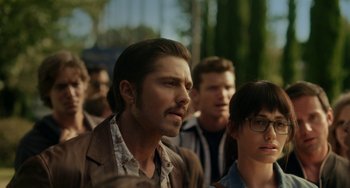 Movie still from “Comet” (2014), directed by Sam Esmail – A group of men standing next to each other; Close Up shot, Over the shoulder angle