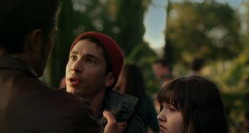 Movie still from “Comet” (2014), directed by Sam Esmail – A man and a woman standing next to each other in a park; Close Up shot, Over the shoulder angle