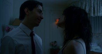 Movie still from “Comet” (2014), directed by Sam Esmail – A man and a woman looking at one another; Close Up shot, Over the shoulder angle