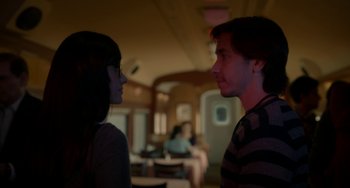 Movie still from “Comet” (2014), directed by Sam Esmail – A man and a woman standing next to each other in a room; Medium shot, Over the shoulder angle
