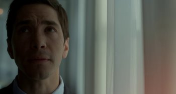 Movie still from “Comet” (2014), directed by Sam Esmail – A person looking out of a window; Close Up shot, Low angle